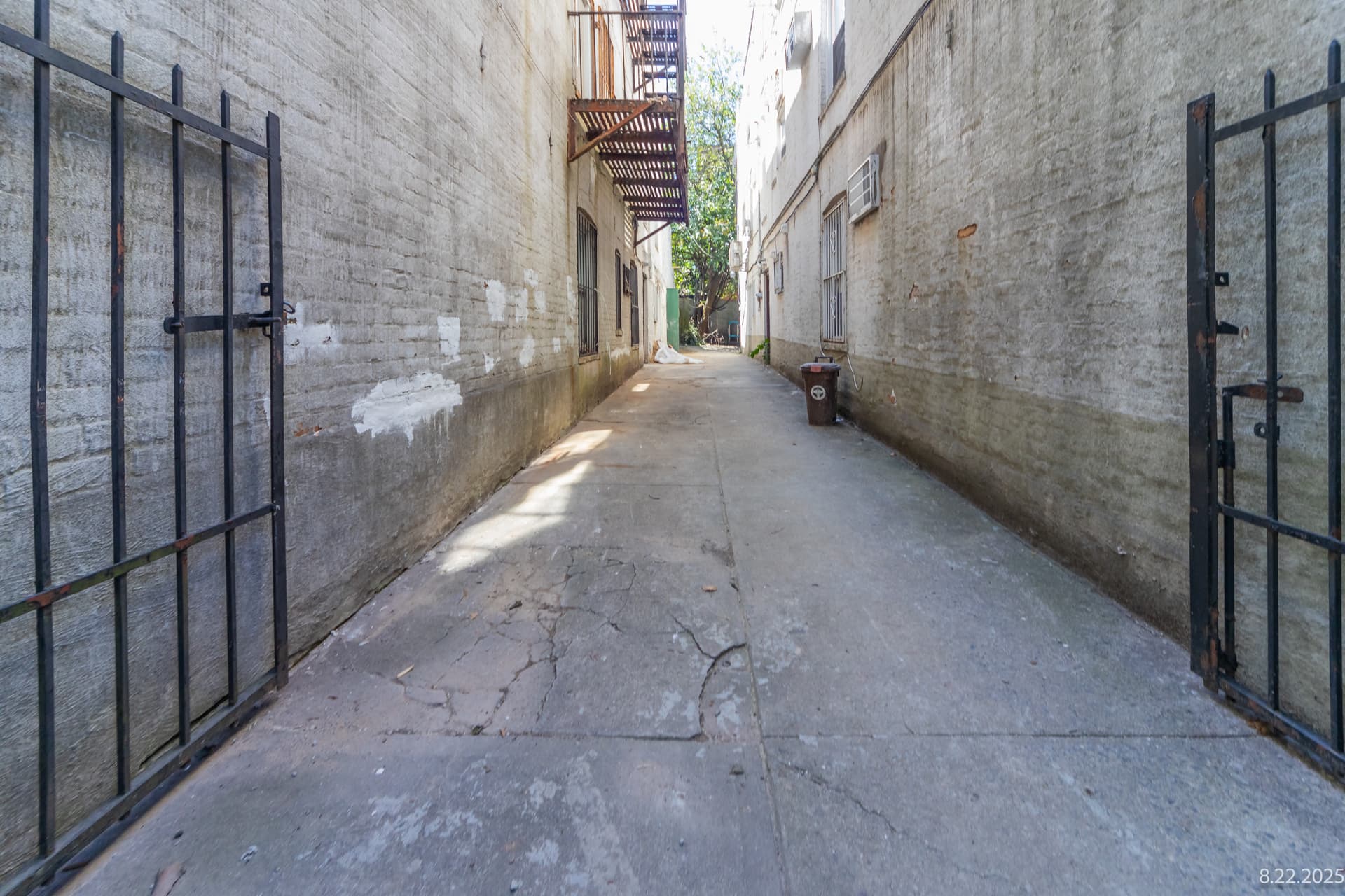 Side alleyway pavement integrity photographed for an OpenDoors360 post construction survey comparison in New York City.
